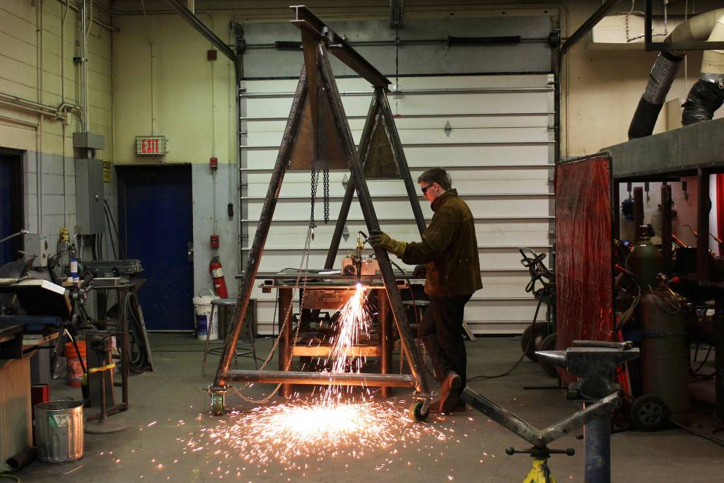 Junior Kevin Steger uses a stick welder during a class at Soldotna High School on Wednesday, Feb. 22, 2023 in Soldotna, Alaska. (Ashlyn OHara/Peninsula Clarion)
