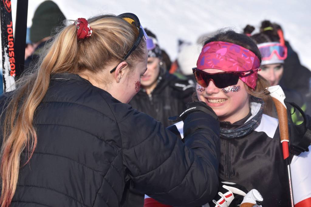 Kenais Madison McDonald smiles after completing the last leg of the girls 4x3.5-kilometer relay at the ASAA State Nordic Ski Championships at Kincaid Park in Anchorage, Alaska, on Saturday, Feb. 25, 2023. (Jake Dye/Peninsula Clarion)