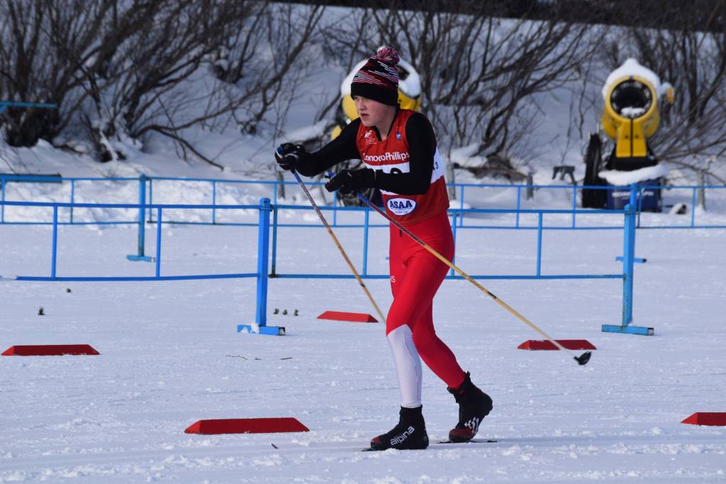 Kenais Logan Cartwright makes the final stretch towards the hand-off at the end of the first leg of the boys 4x5-kilometer relay at the ASAA State Nordic Ski Championships at Kincaid Park in Anchorage, Alaska, on Saturday, Feb. 25, 2023. (Jake Dye/Peninsula Clarion)