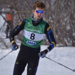 Seamus McDonough, of Homer, rounds a bend during the boys 4x5-kilometer relay at the ASAA State Nordic Ski Championships at Kincaid Park in Anchorage, Alaska, on Saturday, Feb. 25, 2023. (Jake Dye/Peninsula Clarion)