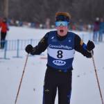 Jody Goodrich gasps for breath as he slows to a stop in the finish chute after the final leg of the boys 4x5-kilometer relay at the ASAA State Nordic Ski Championships at Kincaid Park in Anchorage, Alaska, on Saturday, Feb. 25, 2023. (Jake Dye/Peninsula Clarion)