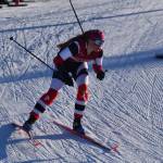 Kenais Emily Moss rounds a bend during the first leg of the girls 4x3.5-kilometer relay at the ASAA State Nordic Ski Championships at Kincaid Park in Anchorage, Alaska, on Saturday, Feb. 25, 2023. (Jake Dye/Peninsula Clarion)