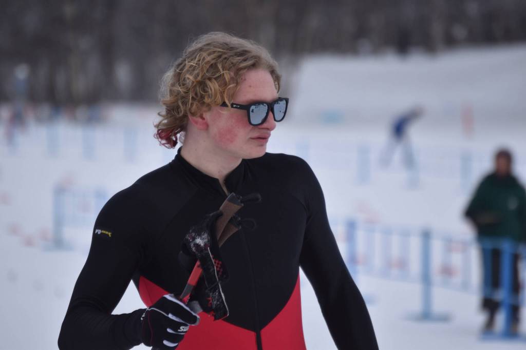 Kenais Jack Laker walks away from the track, moments after completing the final leg of the boys 4x5-kilometer relay at the ASAA State Nordic Ski Championships at Kincaid Park in Anchorage, Alaska, on Saturday, Feb. 25, 2023. (Jake Dye/Peninsula Clarion)