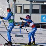 Soldotnas Tania Boonstra reaches out to tag off to teammate Ariana Cannava for the second leg of the girls 4x3.5-kilometer relay at the ASAA State Nordic Ski Championships at Kincaid Park in Anchorage, Alaska, on Saturday, Feb. 25, 2023. (Jake Dye/Peninsula Clarion)