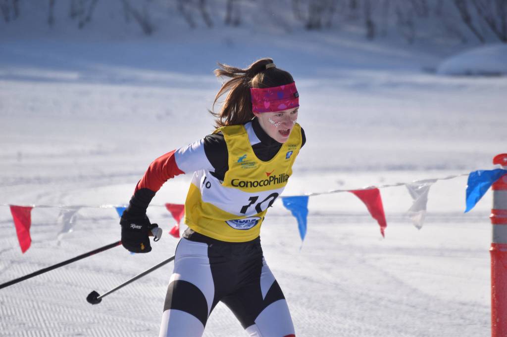 Kenais Mya Taylor pushes through the third leg of the girls 4x3.5-kilometer relay at the ASAA State Nordic Ski Championships at Kincaid Park in Anchorage, Alaska, on Saturday, Feb. 25, 2023. (Jake Dye/Peninsula Clarion)
