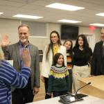 Peter Micciche (second from left) is sworn in as mayor of the Kenai Peninsula Borough on Monday, Feb. 27, 2023 in Soldotna, Alaska. (Ashlyn OHara/Peninsula Clarion)