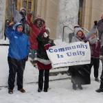 Mark Sabbatini / Juneau Empire
Alaska residents with disabilities and advocates providing services intended to support self-sufficiency wave a banner and noisemakers during a noontime Wednesday rally in a blizzard on the steps of the Alaska State Capitol.