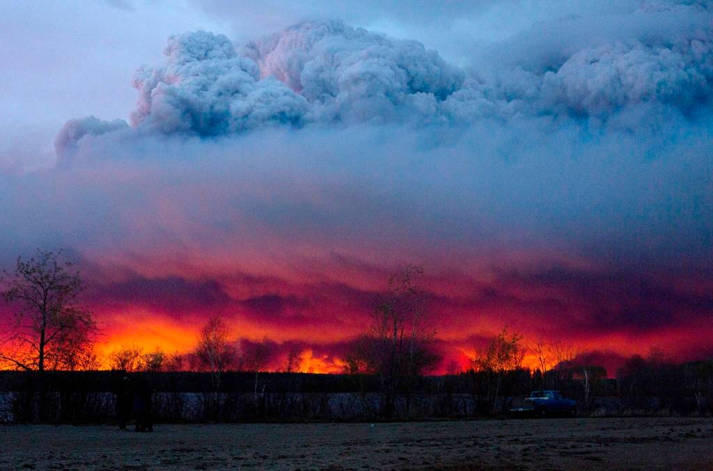 A wildfire moves towards the town of Anzac from Fort McMurray, Alberta., on May 4, 2016. Smoke from boreal fires in 2021 contributed the most to global fire CO2 emissions since 2000, according to a new study in Science being released with a press briefing at the annual AAAS meeting. Using satellite-based atmospheric measurements, researchers from around the world determined that boreal fire smoke made up 23% of global fire CO2 emissions when it typically accounts for 10% of these emissions. (Jason Franson/The Canadian Press via AP, file)
