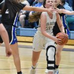 Soldotnas Josie Sheridan drives on Palmers Ariana Belk on Saturday, March 4, 2023, at Soldotna High School in Soldotna, Alaska. (Photo by Jeff Helminiak/Peninsula Clarion)