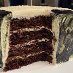 Chocolate cake is topped with white chocolate cream cheese frosting. (Photo by Tressa Dale/Peninsula Clarion)