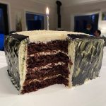 Chocolate cake is topped with white chocolate cream cheese frosting. (Photo by Tressa Dale/Peninsula Clarion)