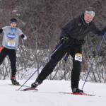 Homers Scott Hauser leads Homers Leif Jaworski up a hill in the 25-kilometer mens race at the Kachemak Nordic Ski Marathon outside of Homer, Alaska, on Saturday, March 18, 2023. (Photo by Erin Thompson/Peninsula Clarion)