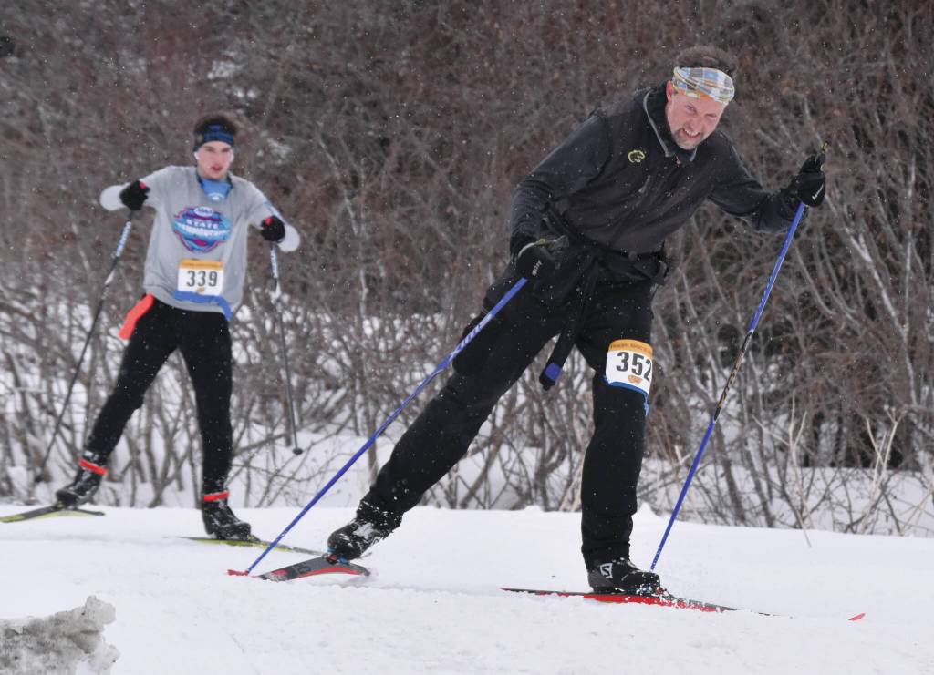 Homers Scott Hauser leads Homers Leif Jaworski up a hill in the 25-kilometer mens race at the Kachemak Nordic Ski Marathon outside of Homer, Alaska, on Saturday, March 18, 2023. (Photo by Erin Thompson/Peninsula Clarion)