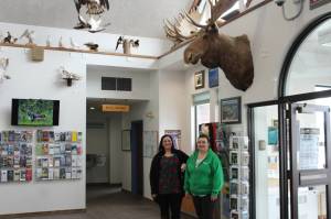 Samantha Springer, left, and Michelle Walker stand in the lobby of the Kenai Chamber of Commerce and Visitor Center on Wednesday, March 22, 2023, in Kenai, Alaska. (Ashlyn OHara/Peninsula Clarion)