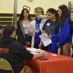 Cole Peterson, of METCO Alaska, talks to a group of students at Seward High Schools Career Day on Thursday, March 23, 2023, at Seward High School in Seward, Alaska. (Jake Dye/Peninsula Clarion)