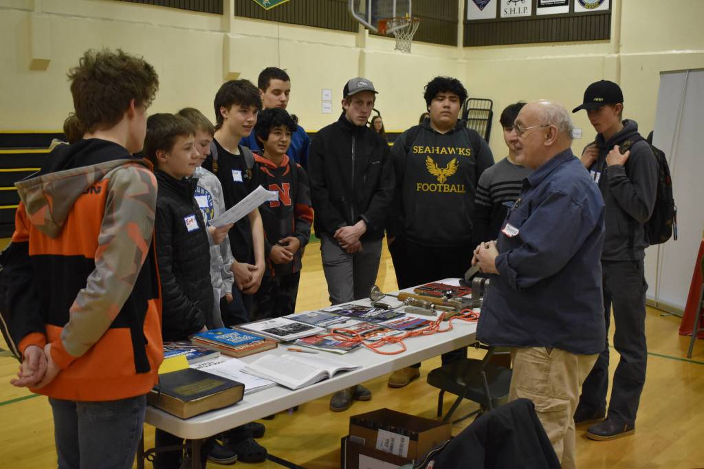 Bruce Jaffa, of Jaffa Construction, speaks to a group of students at Seward High Schools Career Day on Thursday, March 23, 2023, at Seward High School in Seward, Alaska. (Jake Dye/Peninsula Clarion)