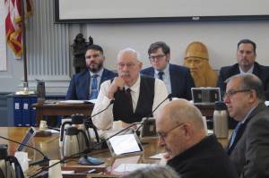Alaska state Sen. Bert Stedman, center, a co-chair of the Senate Finance Committee, listens to a presentation on the major North Slope oil project known as the Willow project on Thursday, March 23, 2023, in Juneau, Alaska. The committee heard an update on the project from the state Department of Natural Resources and the state Department of Revenue. (AP Photo/Becky Bohrer)
