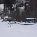 A tripod set by the Soldotna and Kenai Rotary Clubs stands over the ice of the Kenai River in Soldotna, Alaska on Tuesday, March 28, 2023. (Jake Dye/Peninsula Clarion)