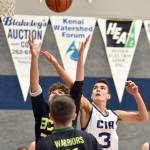 Cook Inlet Academy sophomore Ian McGarry battles for a rebound against Birchwood Christian on Saturday, Jan. 21, 2023, at Cook Inlet Academy just outside of Soldotna, Alaska. (Photo by Jeff Helminiak/Peninsula Clarion)