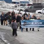 The 11th Annual Alaskans Choose Respect Awareness Event proceeds down Frontage Road in Kenai, Alaska on Wednesday, March 29, 2023. (Jake Dye/Peninsula Clarion)