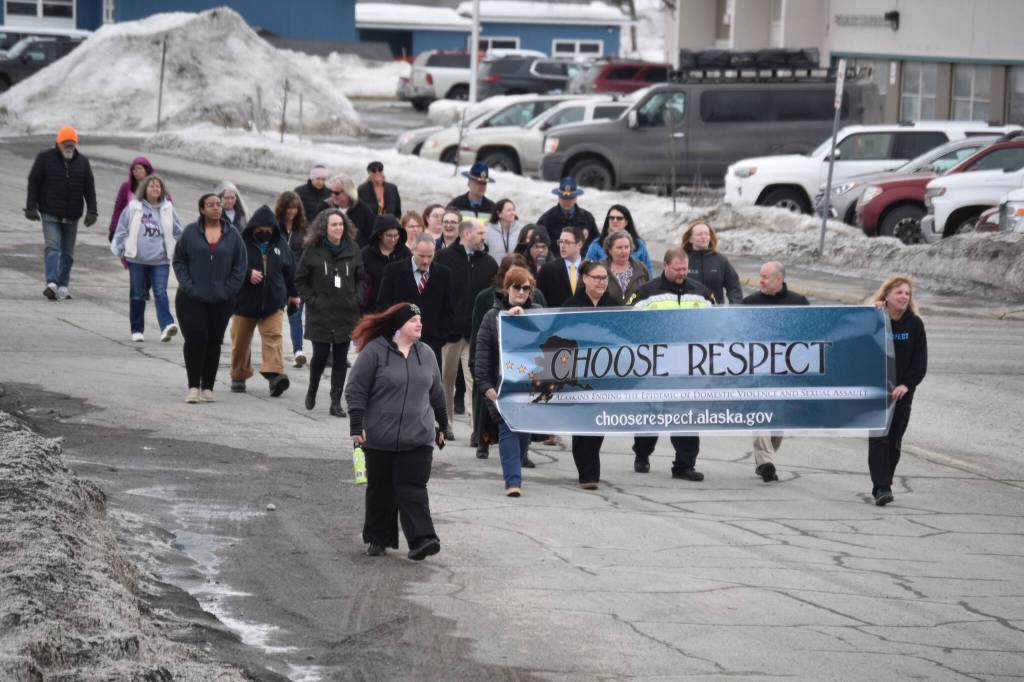 The 11th Annual Alaskans Choose Respect Awareness Event proceeds down Frontage Road in Kenai, Alaska on Wednesday, March 29, 2023. (Jake Dye/Peninsula Clarion)
