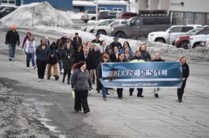 The 11th Annual Alaskans Choose Respect Awareness Event proceeds down Frontage Road in Kenai, Alaska on Wednesday, March 29, 2023. (Jake Dye/Peninsula Clarion)