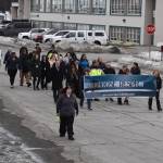 The 11th Annual Alaskans Choose Respect Awareness Event proceeds down Frontage Road in Kenai, Alaska on Wednesday, March 29, 2023. (Jake Dye/Peninsula Clarion)