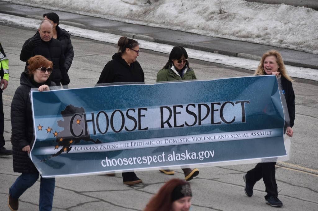 The 11th Annual Alaskans Choose Respect Awareness Event proceeds down Frontage Road in Kenai, Alaska on Wednesday, March 29, 2023. (Jake Dye/Peninsula Clarion)