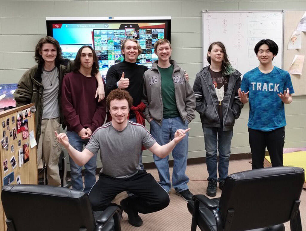 Kenai Central High School and Nikiski Middle/High Schools Super Smash Bros. Ultimate teams stand together for a photo after the first in-person match by Kenai Peninsula Borough School District teams on Monday, March 27, 2023 at Nikiski Middle/High School in Nikiski, Alaska. In the back from left to right is Koen Pace, Cody Good, Kage Adkins, Levi Kimbell, Lincoln Kimbell and Taisei Horiyasu. In front is Silas Thibodeau. (Photo provided by Kenai Central Esports)