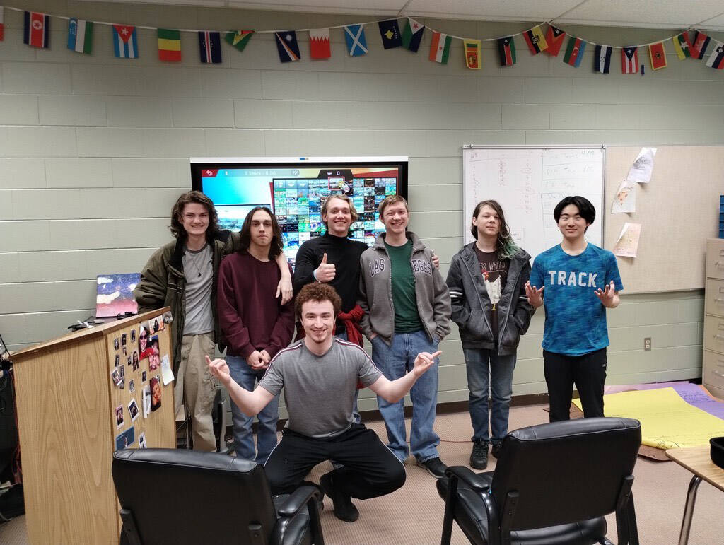 Kenai Central High School and Nikiski Middle/High Schools Super Smash Bros. Ultimate teams stand together for a photo after the first in-person match by Kenai Peninsula Borough School District teams on Monday, March 27, 2023 at Nikiski Middle/High School in Nikiski, Alaska. In the back from left to right is Koen Pace, Cody Good, Kage Adkins, Levi Kimbell, Lincoln Kimbell and Taisei Horiyasu. In front is Silas Thibodeau. (Photo provided by Kenai Central Esports)