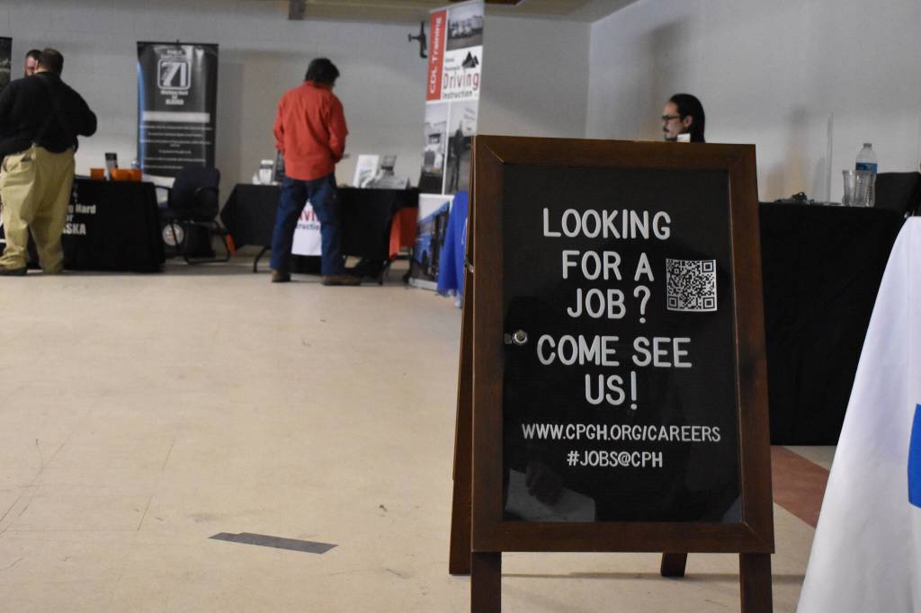 A sign advertising jobs at Central Peninsula Hospital is seen at the Kenai Peninsula Job and Career Fair on Thursday, April 6, 2023, at the Old Carrs Mall in Kenai, Alaska. (Jake Dye/Peninsula Clarion)