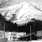 Below the snowy slopes of Mount Marathon stands a building labeled Bank Block, which in August 1971 contained the city of Sewards only bank. (Photo #44.1.7 courtesy of the Resurrection Bay Historical Society)