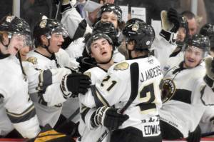 The Kenai River Brown Bears celebrate a goal by Parker Lockwood on Saturday, April 15, 2023, at the Soldotna Regional Sports Complex. (Photo by Jeff Helminiak/Peninsula Clarion)