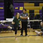 A Homer athlete competing in the senior division performs the Scissor Broad Jump during the Salamatof Tribe Traditional Native Games Invitational at Kenai Middle School in Kenai, Alaska, on Friday, April 14, 2023. (Jake Dye/Peninsula Clarion)