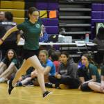 A Homer athlete competing in the senior division performs the Scissor Broad Jump during the Salamatof Tribe Traditional Native Games Invitational at Kenai Middle School in Kenai, Alaska, on Friday, April 14, 2023. (Jake Dye/Peninsula Clarion)