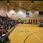 Packed stands watch traditional drumming during the opening ceremony of the Salamatof Tribe Traditional Native Games Invitational at Kenai Middle School in Kenai, Alaska, on Friday, April 14, 2023. (Jake Dye/Peninsula Clarion)
