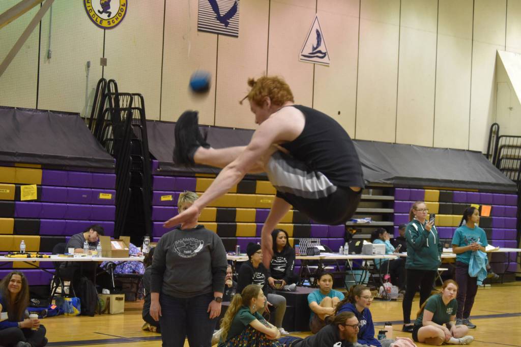 Homers Elijah Gordon performs the 2-Foot High Kick during the Salamatof Tribe Traditional Native Games Invitational at Kenai Middle School in Kenai, Alaska, on Friday, April 14, 2023. Gordon would ultimately place 2nd in the event. (Jake Dye/Peninsula Clarion)