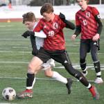 Soldotnas Owen Buckbee and Kenai Centrals Sawyer Vann battle for the ball Tuesday, April 18, 2023, at Ed Hollier Field at Kenai Central High School in Kenai, Alaska. (Photo by Jeff Helminiak/Peninsula Clarion)