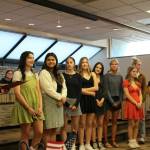 Kenai Mayor Brian Gabriel, left, presents a proclamation recognizing members of the Kenai Central High School cheer team for wining their thrid straight Division II March Madness state competition during a Kenai City Council meeting on Wednesday, April 19 2023 in Kenai, Alaska. From left: Maya Montague, Genesis Trevino, Sarah Baisden, Taya Swick, Sylvia McGraw, Malena Grieme, Mackenzie Harden, Kalani Holmes, Brooklynn Reed, Brianna Force. (Ashlyn OHara/Peninsula Clarion)