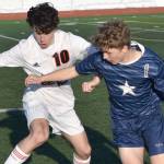 Kellen Chester of Juneau-Douglas: Yadaa.at Kale and Owen Buckbee of Soldotna battle for the ball Friday, April 21, 2023, at Ed Hollier Field at Kenai Central High School in Kenai, Alaska. (Photo by Jeff Helminiak/Peninsula Clarion)