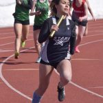 Soldotnas Angelina Chavarria helps Soldotnas 400-meter relay team to a victory in the SoHi Invitational on Saturday, April 22, 2023, at Justin Maile Field at Soldotna High School in Soldotna, Alaska. (Photo by Jeff Helminiak/Peninsula Clarion)