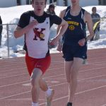 Kenai Centrals Greg Fallon leads Homers Seamus McDonough in the 800-meter run Saturday, April 22, 2023, at the SoHi Invitational at Justin Maile Field at Soldotna High School in Soldotna, Alaska. (Photo by Jeff Helminiak/Peninsula Clarion)