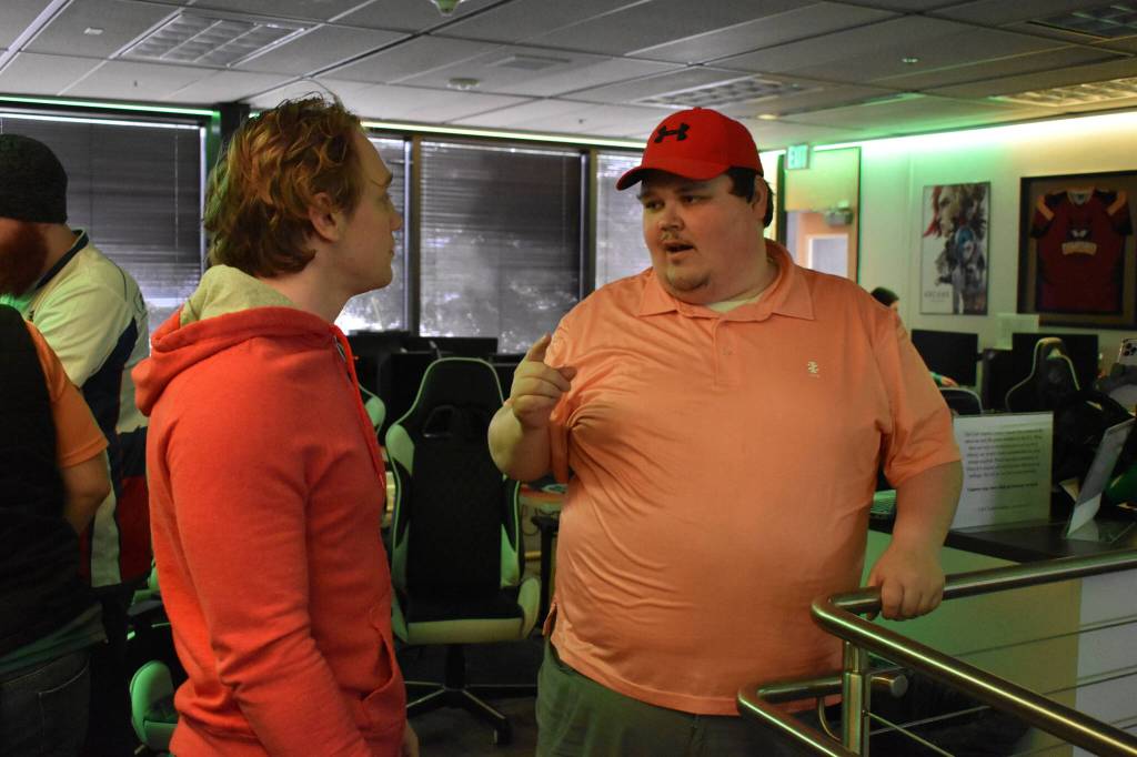 Kenai Centrals Kage Adkins talks to Coach Matthew Cross after the last match of the Super Smash Bros. Ultimate State Championship on Saturday, April 22, 2023, at the University of Alaska Anchorage Esports Lounge in Anchorage, Alaska. (Jake Dye/Peninsula Clarion)