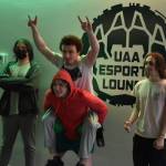 Kenai Centrals Landon Dubber, Silas Thibodeau, Kage Adkins and Cody Good stand together for a photo after their last match on Saturday, April 22, 2023, at the University of Alaska Anchorage Esports Lounge in Anchorage, Alaska. (Jake Dye/Peninsula Clarion)