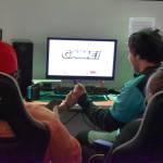 Kenai Centrals Cody Good and Chugiaks Elliott Barnes bump knuckes at the end of the first round of the final match of the Super Smash Bros. Ultimate State Championship on Saturday, April 22, 2023, at the University of Alaska Anchorage Esports Lounge in Anchorage, Alaska. (Jake Dye/Peninsula Clarion)