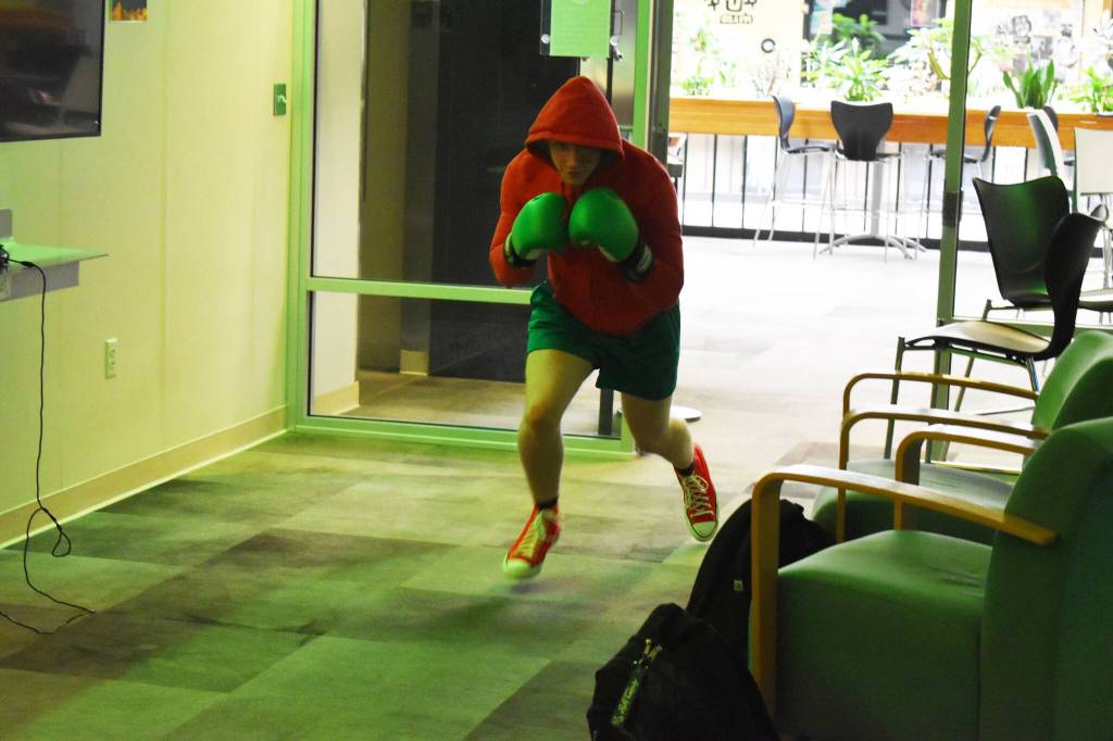 Kenai Centrals Kage Adkins, dressed as Little Mac, enters for the final match of the Super Smash Bros. Ultimate State Championship on Saturday, April 22, 2023, at the University of Alaska Anchorage Esports Lounge in Anchorage, Alaska. (Jake Dye/Peninsula Clarion)
