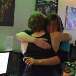 Kenai Centrals Kage Adkins shares a hug with Chugiaks Addison Rains after the last match of the Super Smash Bros. Ultimate State Championship on Saturday, April 22, 2023, at the University of Alaska Anchorage Esports Lounge in Anchorage, Alaska. (Jake Dye/Peninsula Clarion)