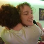 Kenai Centrals Silas Thibodeau and Kage Adkins share a hug after the last match of the Super Smash Bros. Ultimate State Championship on Saturday, April 22, 2023, at the University of Alaska Anchorage Esports Lounge in Anchorage, Alaska. (Jake Dye/Peninsula Clarion)