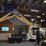 A large wooden structure makes up the booth for Builders Choice at the 43rd Annual Home Show hosted by the Kenai Peninsula Builders Association on Sunday, April 23, 2023, at the Soldotna Regional Sports Complex in Soldotna, Alaska. (Jake Dye/Peninsula Clarion)
