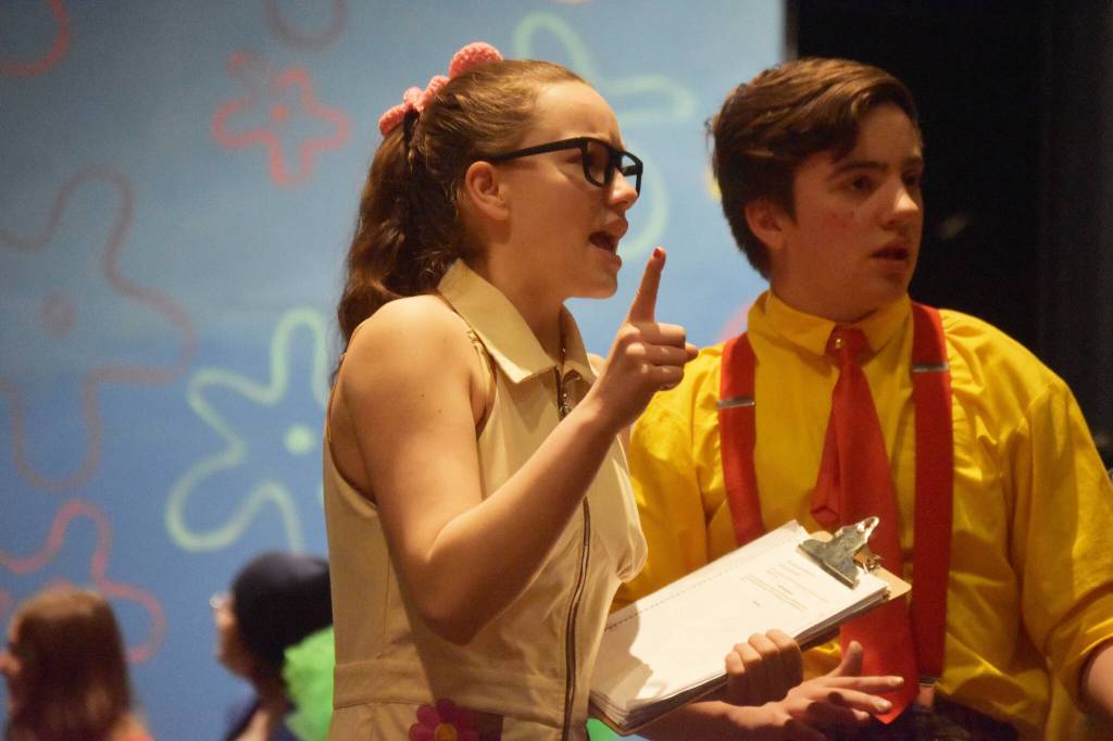 Maggie Grenier portrays Sandy Cheeks alongside Jackson Hoopers SpongeBob during a rehearsal of SpongeBob SquarePants on Saturday, April 15, 2023, at Nikiski Middle/High School in Nikiski, Alaska. (Jake Dye/Peninsula Clarion)